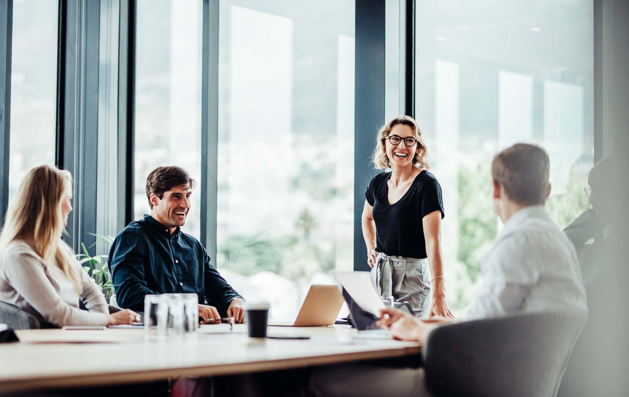 Business people having casual discussion during meeting
